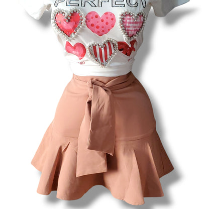 Falda con volantes y short incluido con lazo ajustable